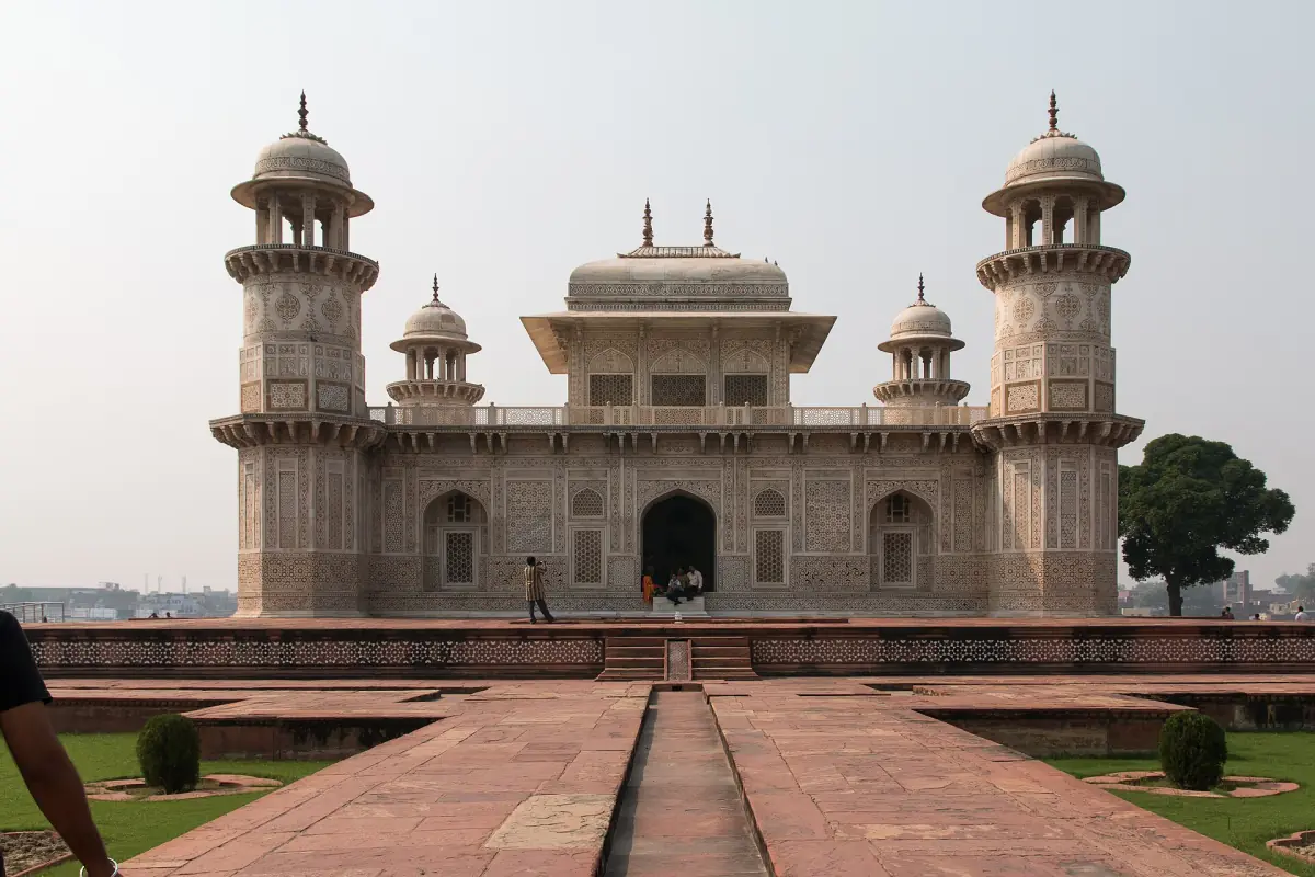 Itimad-ud-Daulah mausoleum seen along a stone walkway with a water channel