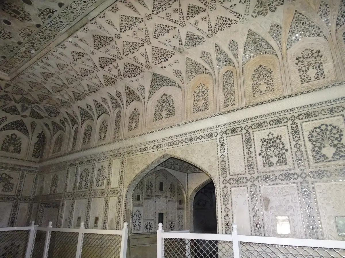Mirror mosaic ceiling and arched walls inside the Sheesh Mahal